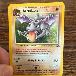 Holo Pokemon Aerodactyl Trading Card - Yellow, Purple, Gray